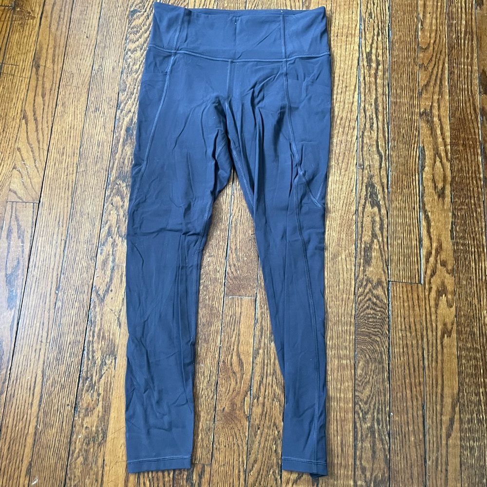 Athleta Stash Pocket Salutation Leggings
